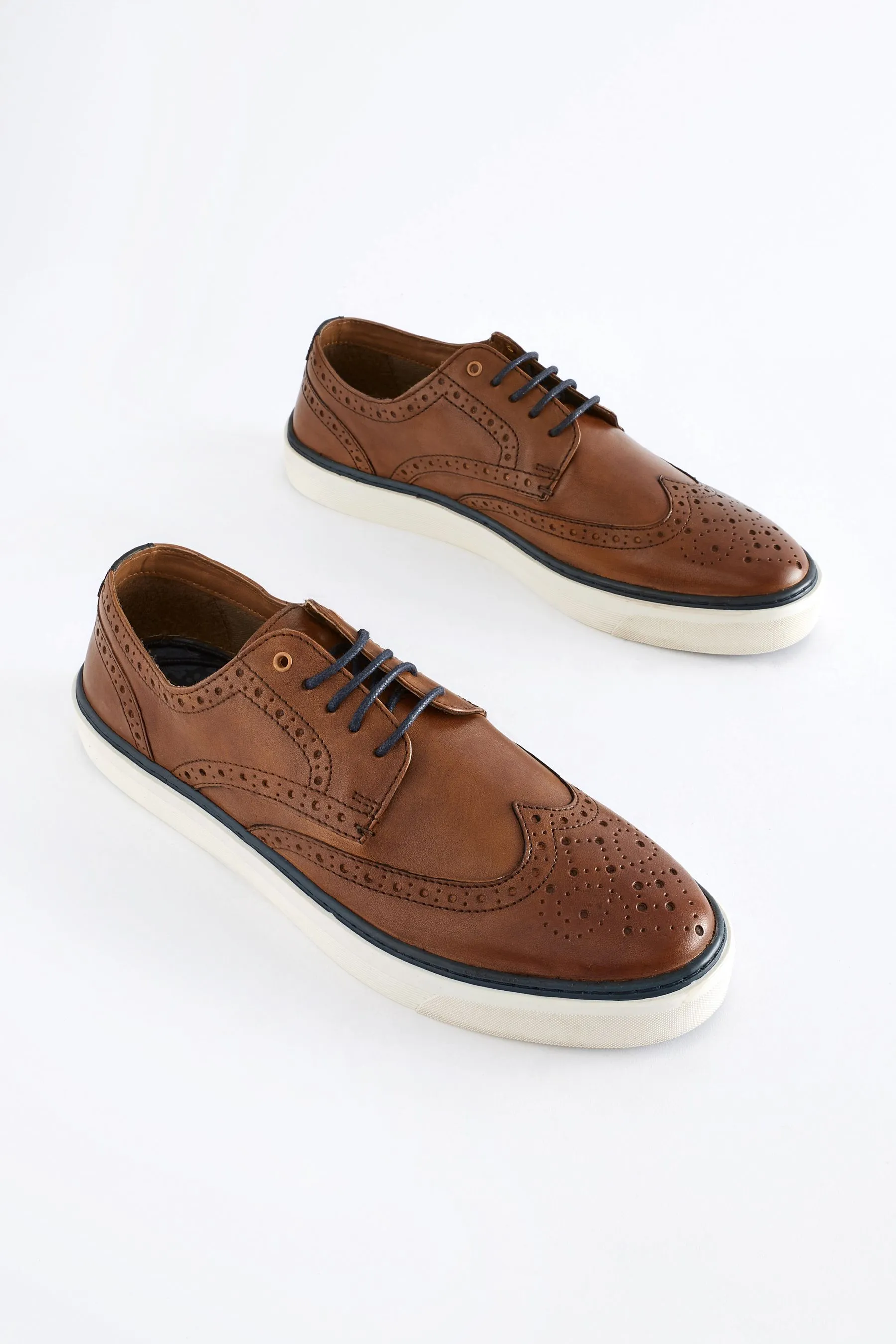 Scarpe in pelle brogue con suola sagomata