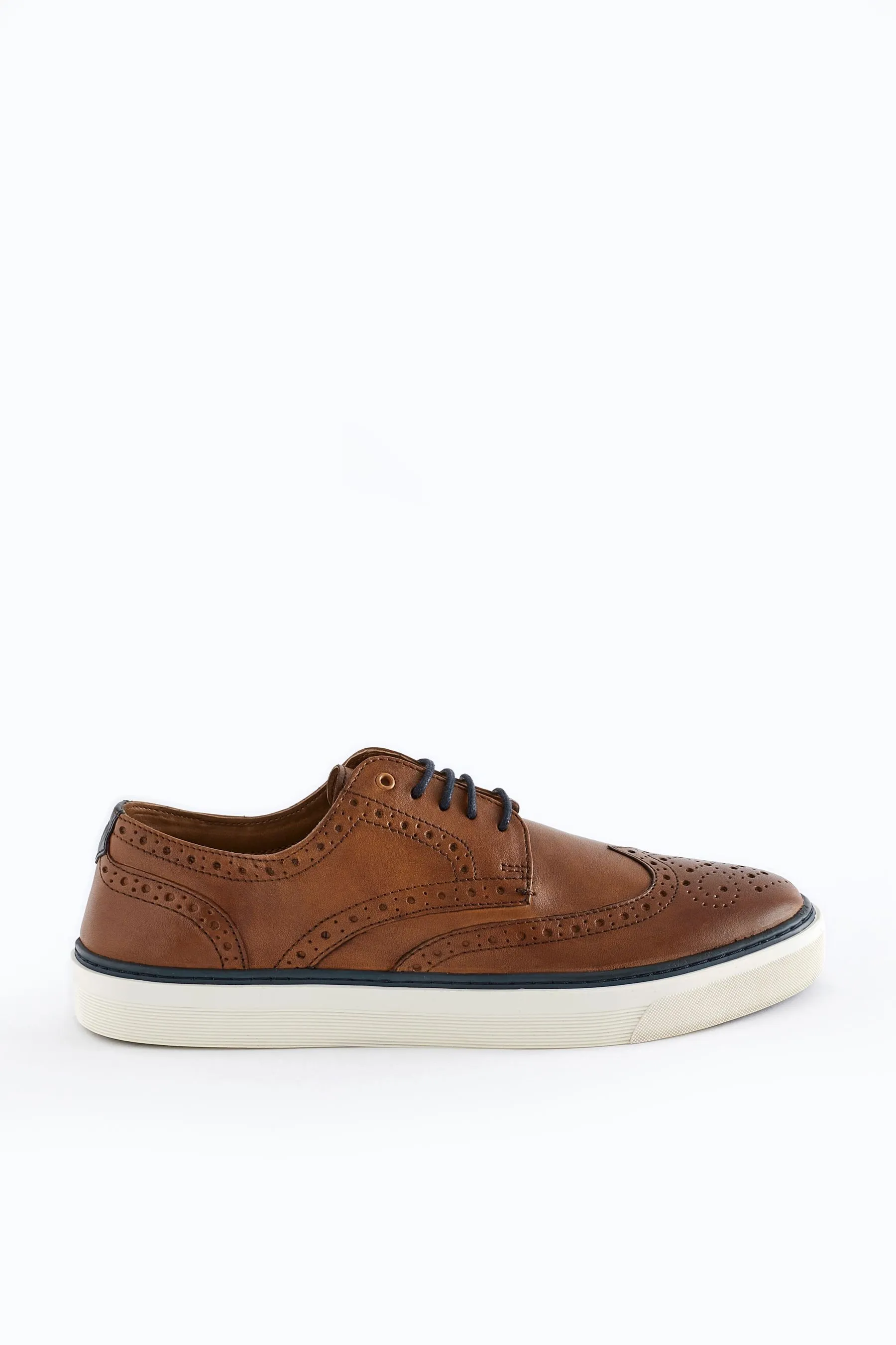 Scarpe in pelle brogue con suola sagomata