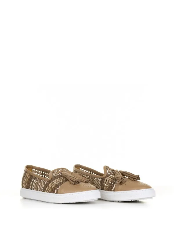 Slip-ons in woven leather with tassels